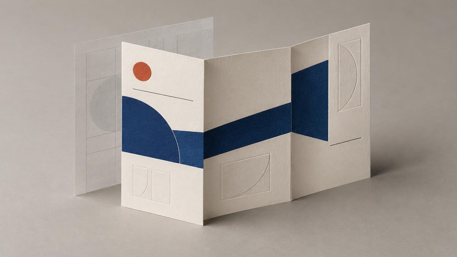 Minimalist folded invitation mockup with cream paper panels, a dark navy geometric band crossing the folds, a small rust-orange circle, embossed semicircle details, and a translucent layout sheet behind it.